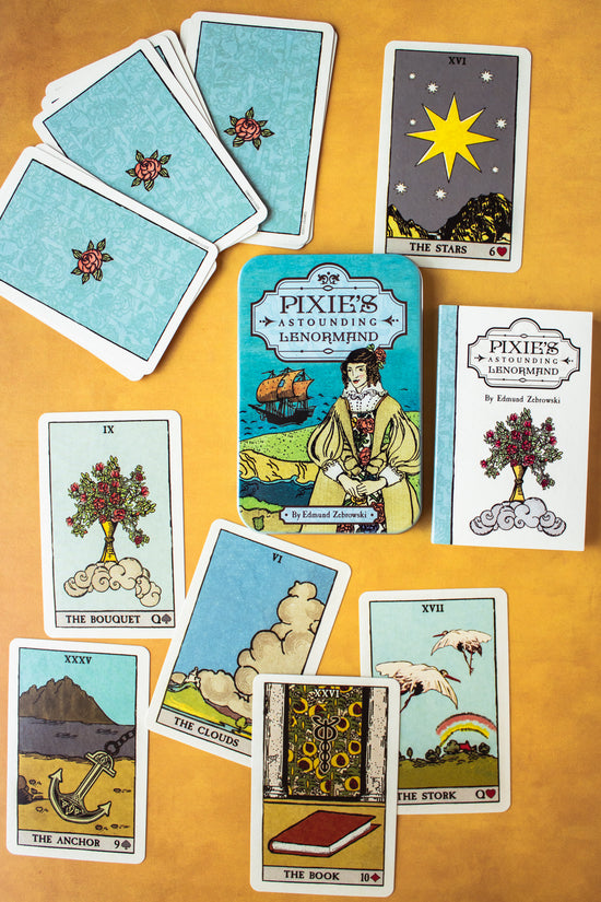 Pixie's Astounding Lenormand cards. This deck features artwork reminiscent of traditional Tarot archetypes, but in a simpler fashion. This 36-card deck comes with a guidebook and symbolic cards like The Bouquet, The Clouds, The Stork, The Stars, and more.