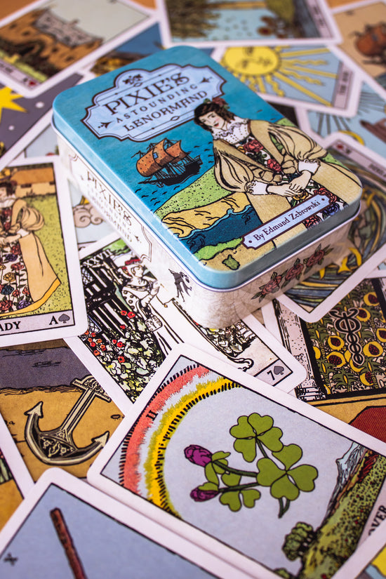 Pixie's Astounding Lenormand cards. This deck features artwork reminiscent of traditional Tarot archetypes, but in a simpler fashion.